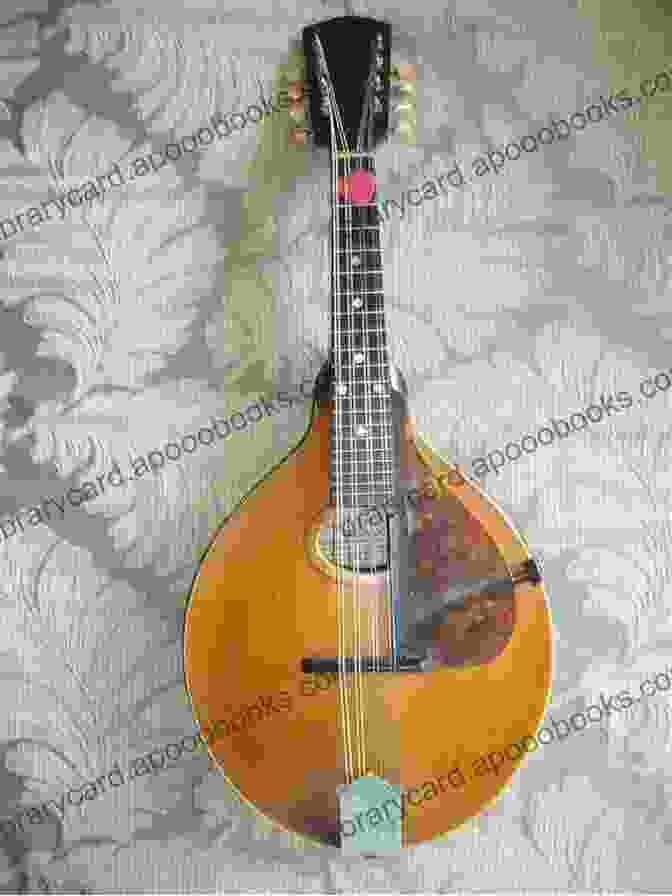 A Close Up Of A Mandolin Resting On A Wooden Surface, With A Handwritten Musical Score In The Background. New Classics For Bluegrass Mandolin