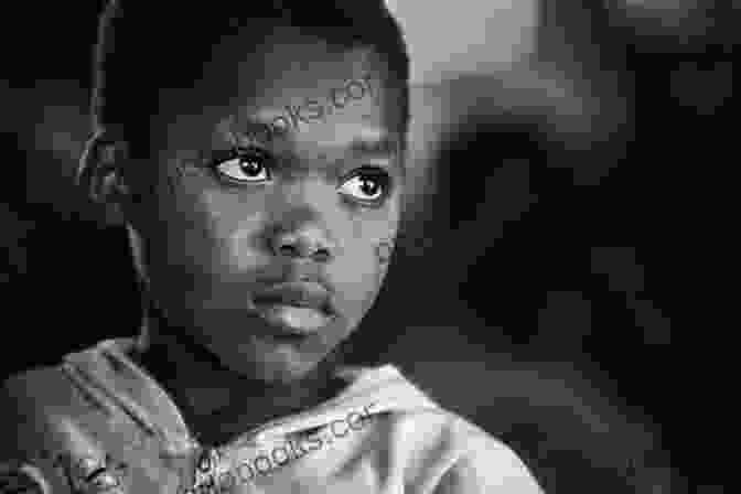 A Close Up Portrait Of Jubu, A Young Orphan With Determined Eyes And A Gentle Smile. Journey Of A JuBu Blaine Langberg