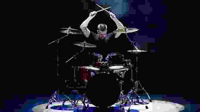 A Drummer Playing A Drum Set In A Live Performance. Drumming In Color: A Colorful Guide To The Drum Set