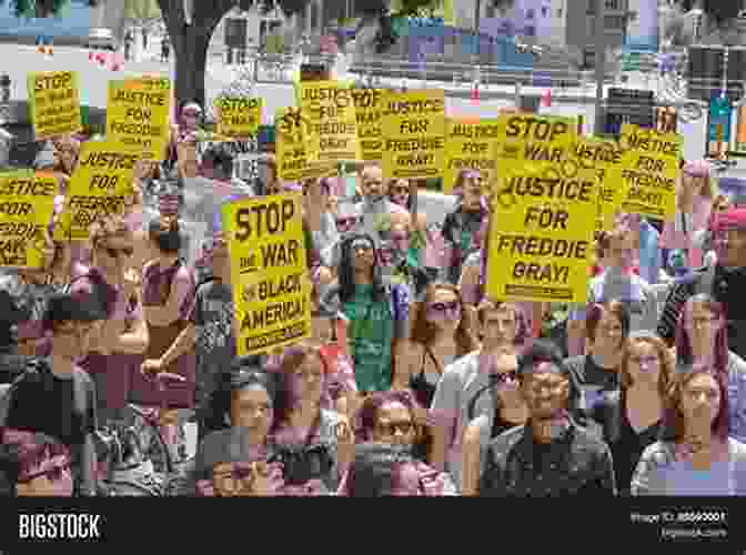 A Group Of People Holding Up Signs Supporting The First Amendment The Language Police: How Pressure Groups Restrict What Students Learn