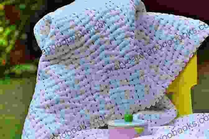 A Happy Baby Snuggled In A Handmade Baby Blanket Quick Easy Baby Blankets: 6 Crochet Patterns With Step By Step Photos (Tiger Road Crafts)