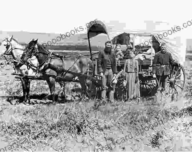 A Pioneer Family Sitting By Their Wagon, A Baby In The Mother's Arms The Wagon Train Trek (The Oregon Trail)