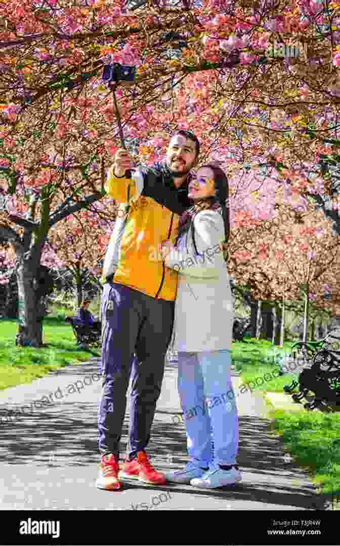 Couple Admiring Cherry Blossoms In Full Bloom Japan: A Romantic Getaway Guide For Couples