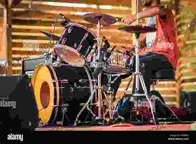 Master Drummer Performing On Stage With An Impassioned Expression, Surrounded By A Vibrant Crowd Jaki Liebezeit: The Life Theory And Practice Of A Master Drummer