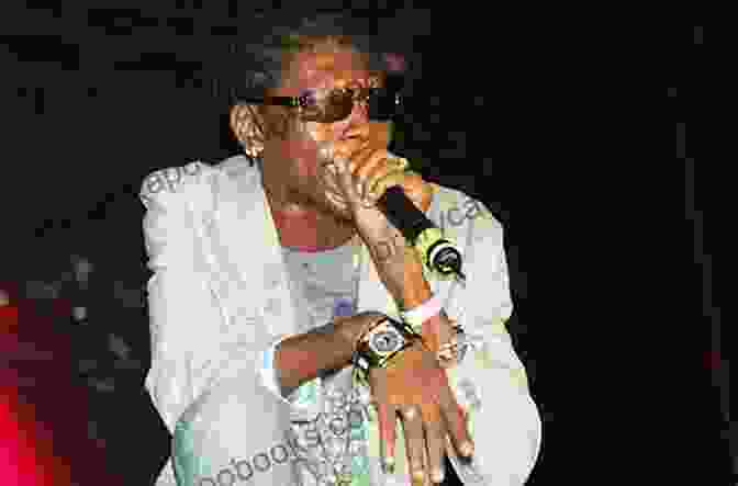 Vybz Kartel Performing On A Stage With Crowd Cheering. Dancehall Hit List Volume 2: A List Of The 30 Hottest Underground Dancehall Hits To Ever Touch Road DJs Sound Systems Fans Of Dancehall And Hollywood Producers Take Note